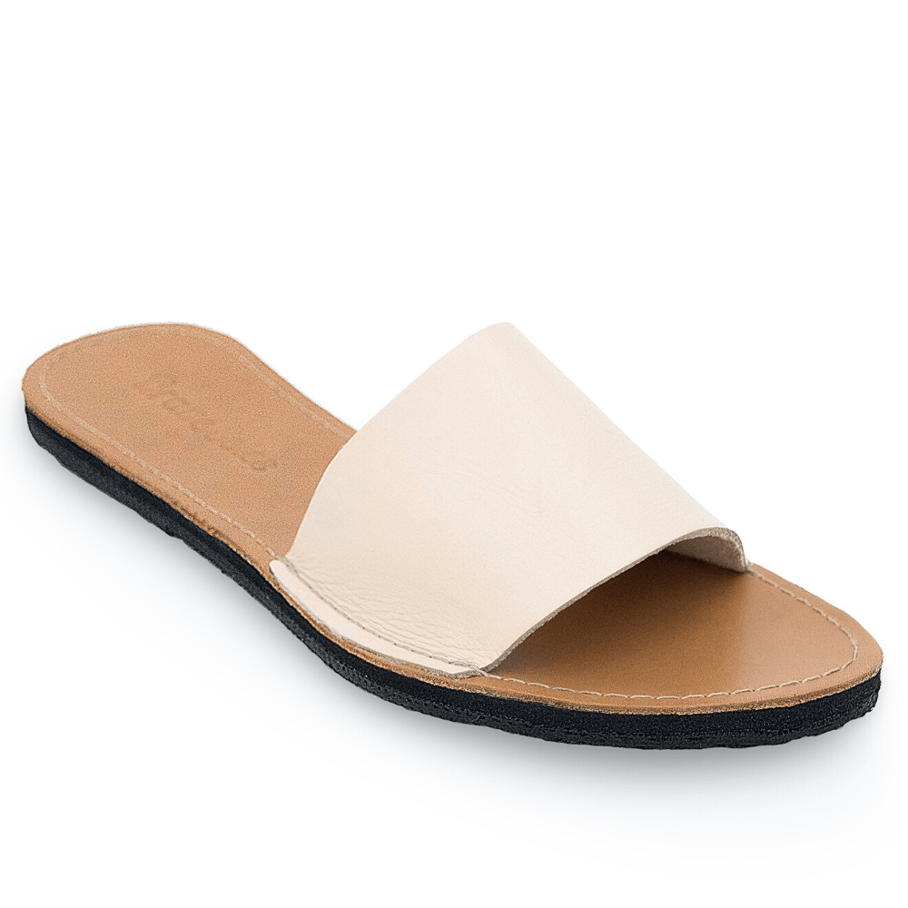 The Linda Women's Leather Slide Sandal in ivory and natural color sustainably made by Brave Soles.