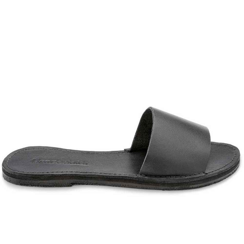 Side view of theThe Linda Women's Leather Slide Sandal in black color, sustainably made by Brave Soles.