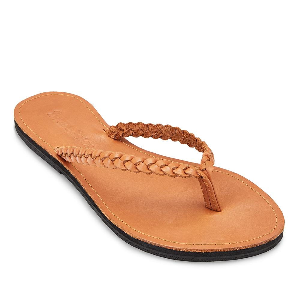 Front side view of The Trenza  leather flip flop sustainably made with upcycled tire soles by  Brave Soles in caramel color. 